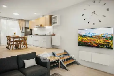 Modern open-concept living room and kitchen with stylish decor and natural light.