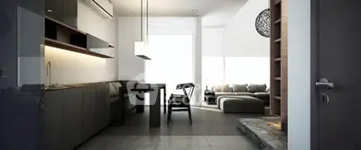 Modern open-layout living room with sleek kitchen and stylish furniture