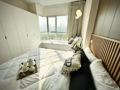 Luxurious bedroom with stunning city view and elegant decor