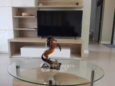 Modern living room with stylish TV stand and glass coffee table