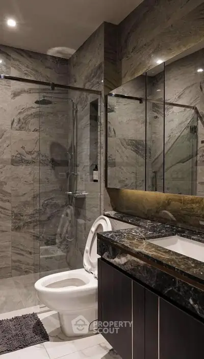 Luxurious modern bathroom with marble walls and sleek fixtures