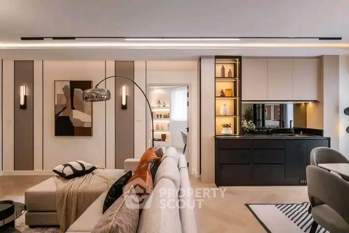 Luxurious modern living room with elegant decor and open kitchen layout, perfect for stylish urban living.