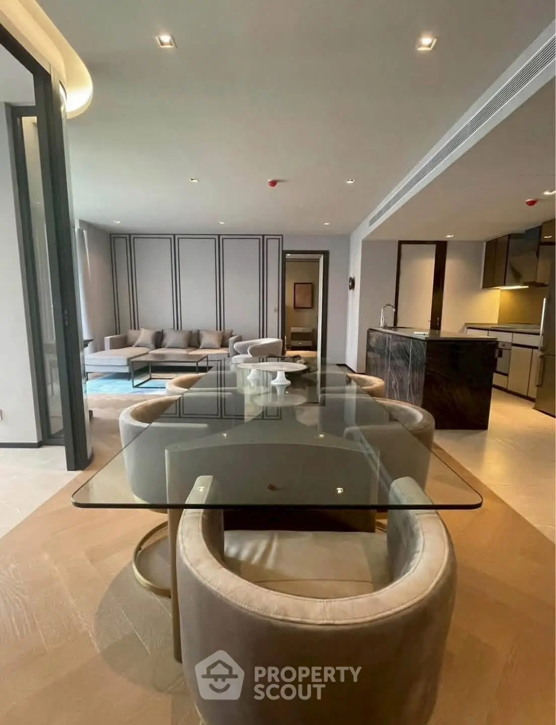 Luxurious open-plan living room with modern kitchen and elegant dining area