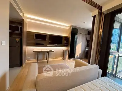 Modern living room with sleek design and large windows offering natural light and city views.