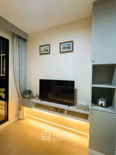 Modern living room with sleek TV setup and ambient lighting
