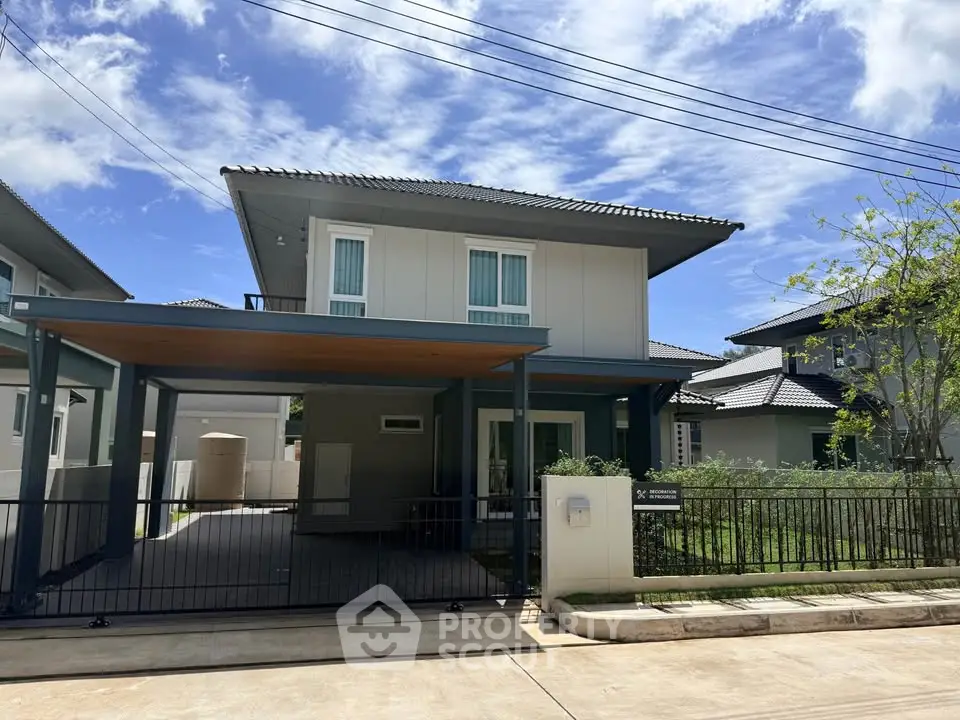 Modern two-story house with sleek design and spacious driveway in a serene neighborhood.