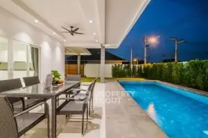 Luxurious outdoor patio with dining area and private pool, perfect for entertaining and relaxation.