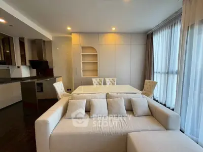 Modern living room with elegant dining area and open kitchen layout
