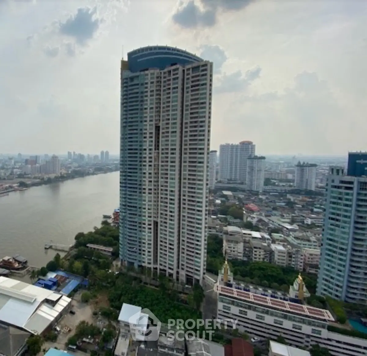 Stunning high-rise building with river view in urban landscape