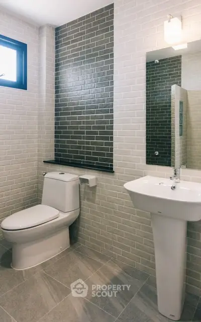 Modern bathroom with sleek design and stylish tile accents