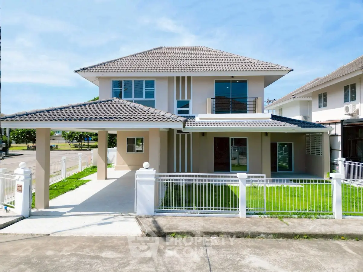 Stunning two-story house with modern design and spacious driveway in a serene neighborhood.