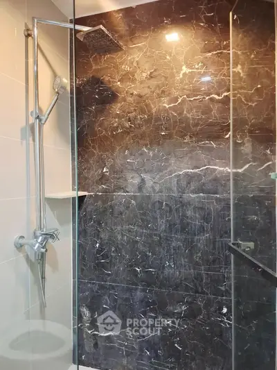Luxurious bathroom with elegant marble shower and modern fixtures