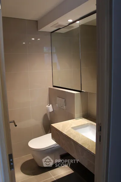 Modern bathroom with sleek design and elegant fixtures in a contemporary home.