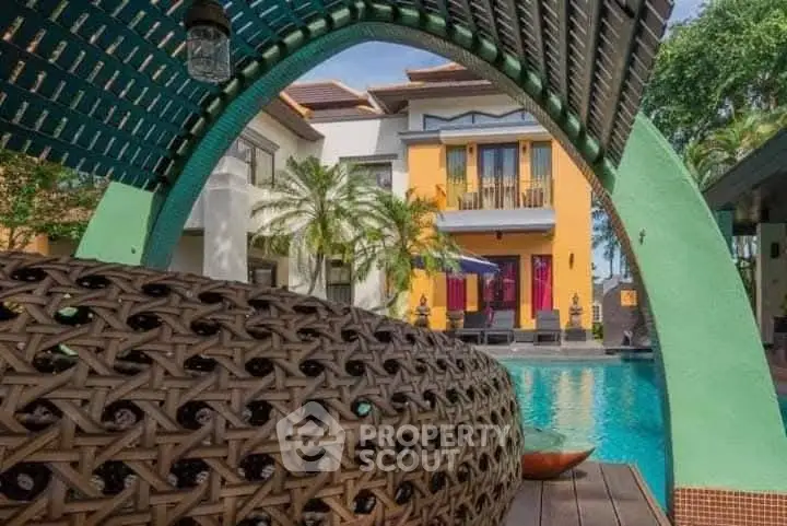 Luxurious tropical villa with stunning pool and unique architectural design.