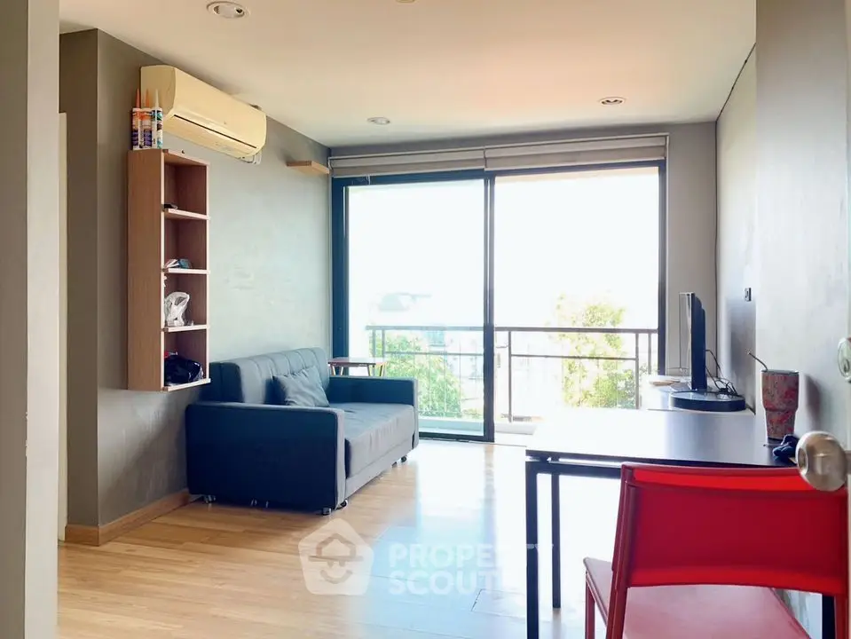 Modern living room with balcony view and stylish furnishings