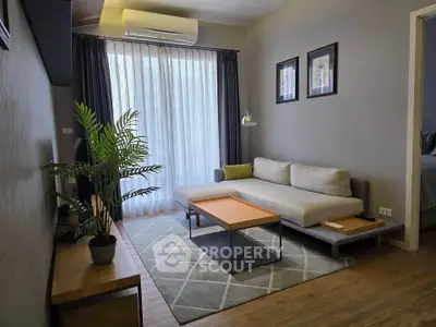 Modern living room with stylish decor, featuring a cozy sofa, elegant curtains, and a chic coffee table.