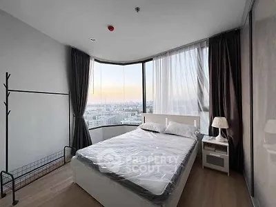 Modern bedroom with panoramic city view and stylish decor