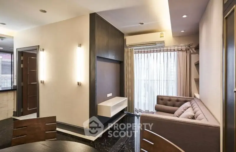 Modern living room with sleek furniture and natural light