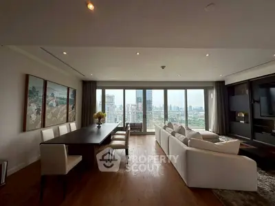 Luxurious living room with stunning city view and elegant dining area
