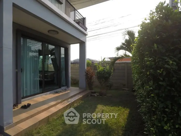 Charming garden view with patio and lush greenery in modern home exterior