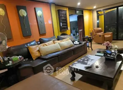 Spacious living room with modern decor and comfortable seating