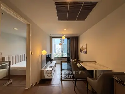 Modern living room with city view, stylish furniture, and open layout