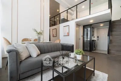 Modern duplex living room with stylish decor and mezzanine level