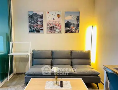 Modern living room with stylish sofa and artistic wall decor