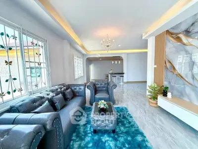 Luxurious living room with elegant decor and modern furnishings, featuring a plush sofa and stylish lighting.