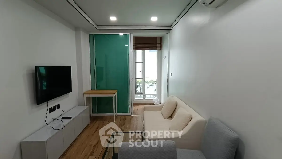 Modern living room with sleek furniture and natural light