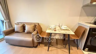 Cozy living room with modern dining area and stylish furniture in a contemporary apartment.