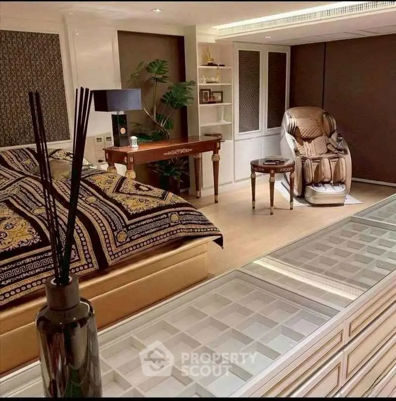 Luxurious bedroom with massage chair and elegant decor