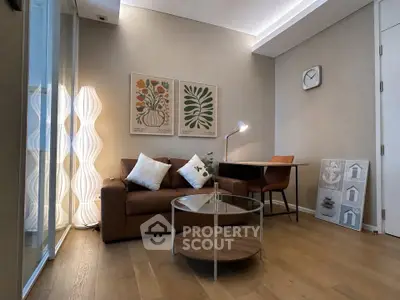 Modern living room with stylish decor, cozy sofa, and elegant lighting, perfect for relaxation and work-from-home setup.