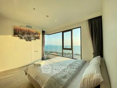 Luxurious bedroom with stunning ocean view and modern decor
