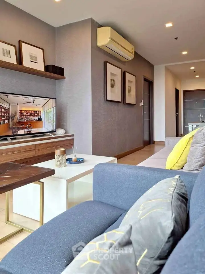 Modern living room with stylish decor and cozy seating area.