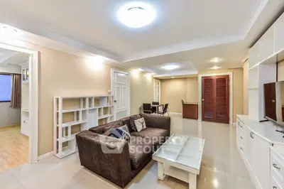 Spacious living room with modern furniture and bright lighting