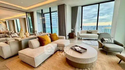 Luxurious modern living room with panoramic city views and elegant furnishings.