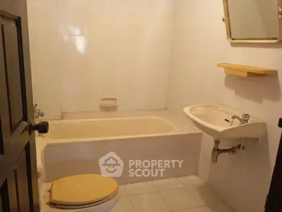 Cozy bathroom with bathtub and sink in a compact layout