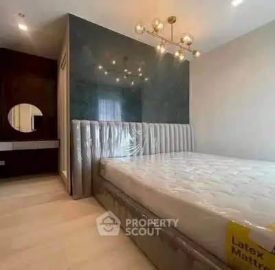 Luxurious bedroom with modern chandelier and stylish decor