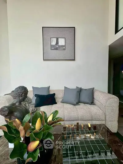 Stylish living room with modern decor and plush sofa in a contemporary apartment.