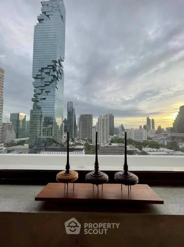 Stunning cityscape view from a high-rise window with iconic architecture.