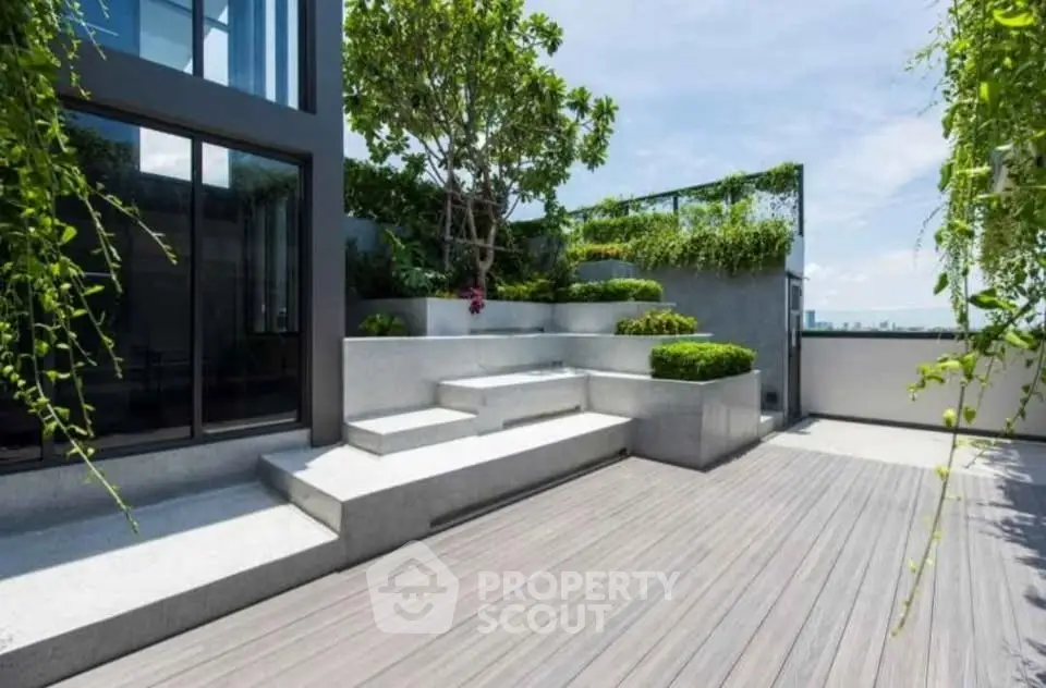 Luxurious rooftop garden with modern design and stunning city views.