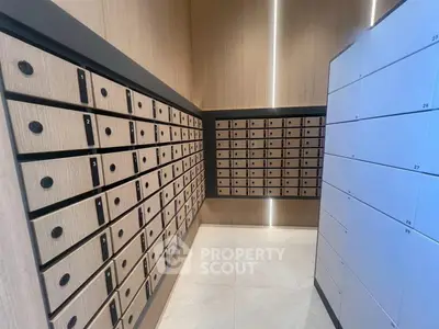 Modern apartment building mailroom with sleek wooden mailboxes and secure parcel lockers.