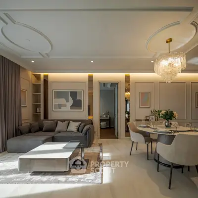 Luxurious modern living room with elegant chandelier and cozy seating area