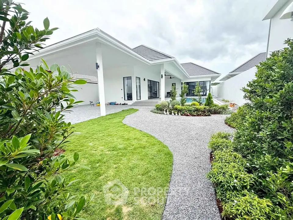 Stunning modern home with lush garden and sleek architecture, perfect for luxury living.