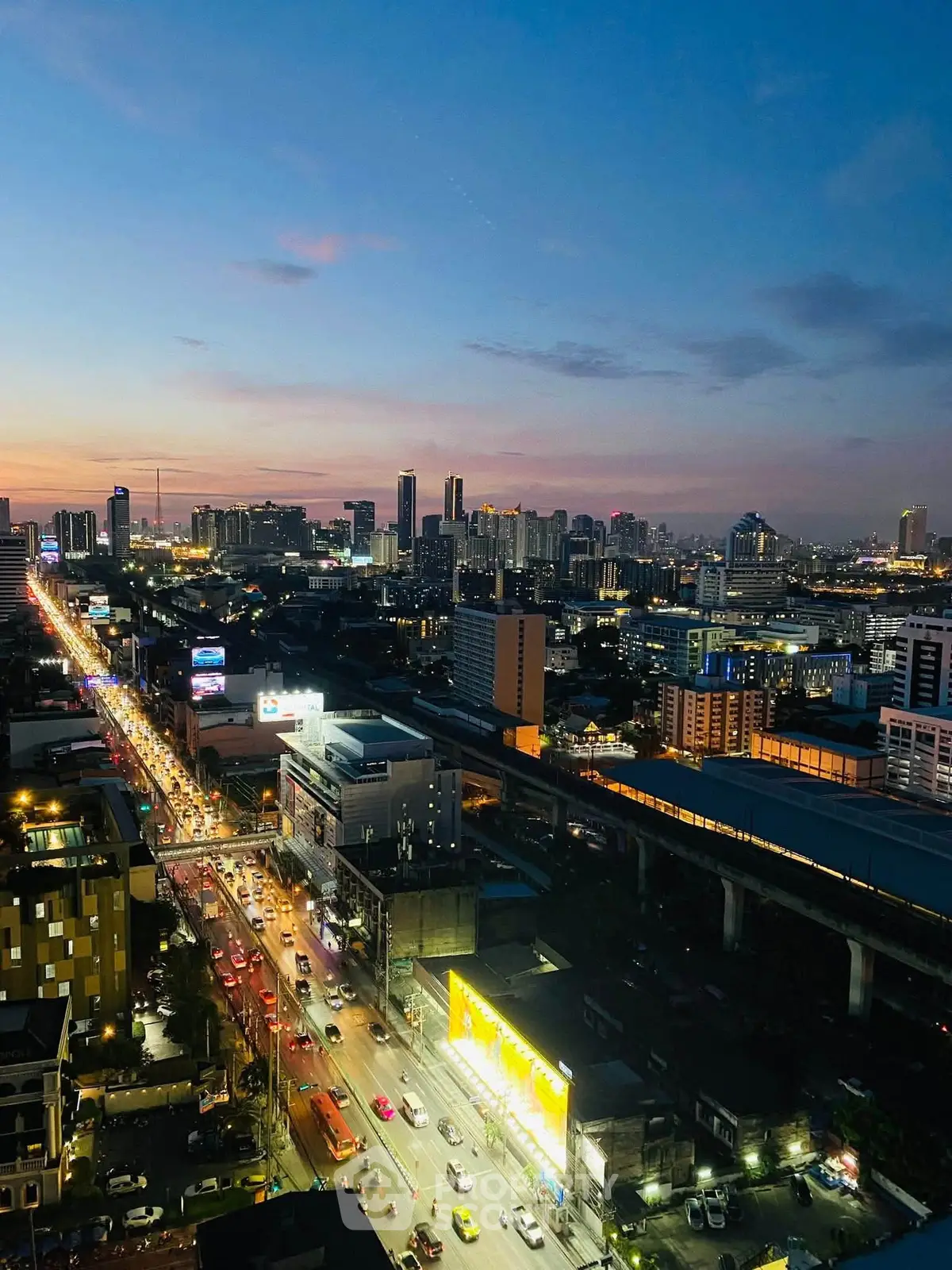 Stunning cityscape view at dusk with vibrant skyline and bustling streets, perfect for urban living enthusiasts.