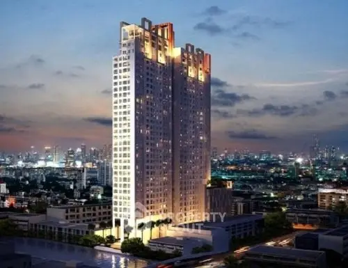 Stunning high-rise building with cityscape view at dusk, perfect for urban living.