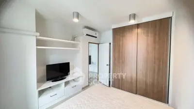Modern bedroom with built-in wardrobe and sleek design, perfect for urban living.