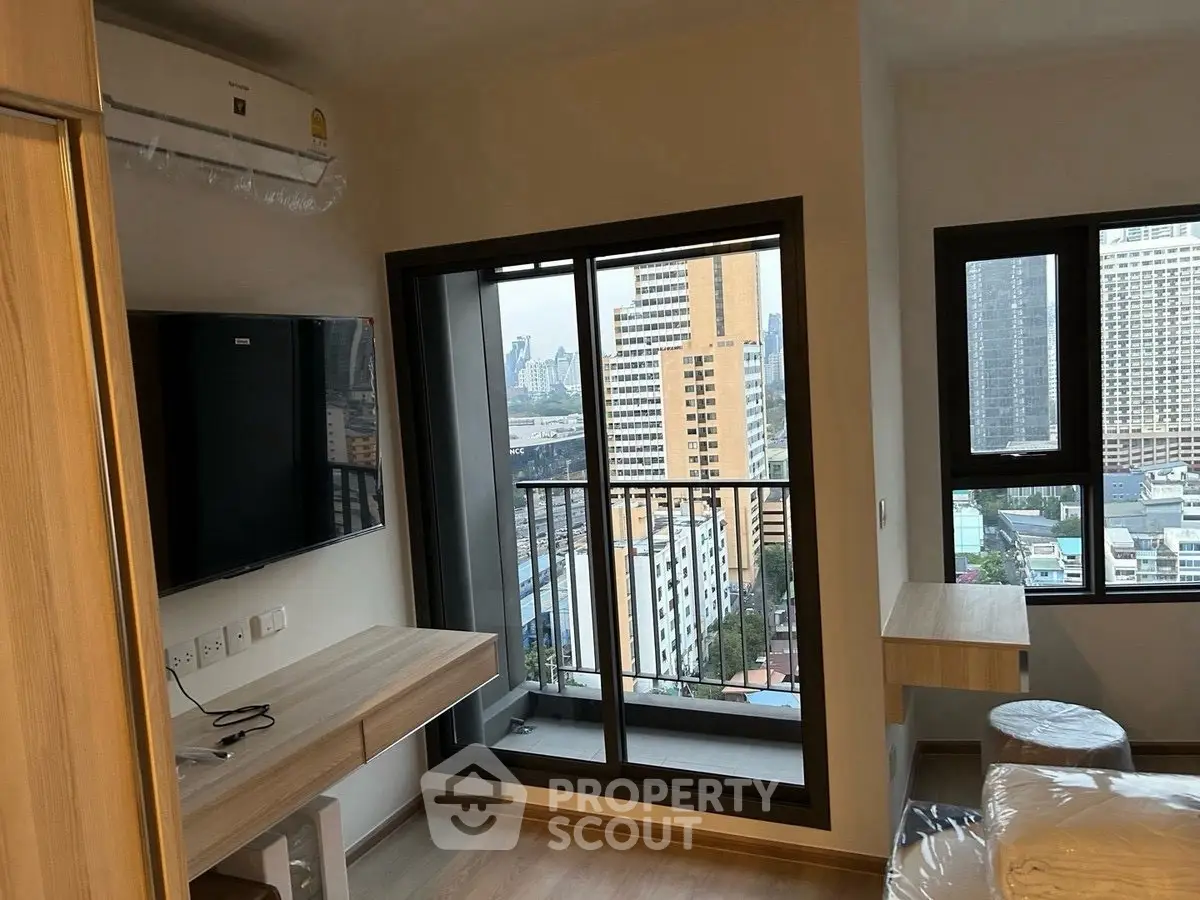 Modern apartment interior with city view and balcony access