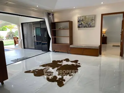 Spacious living room with modern decor and garden view